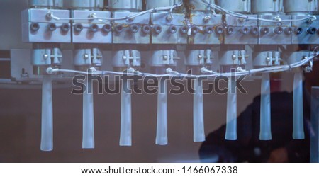 Process of PET plastic jar on blow molding machine. Industrial plastic factory production line