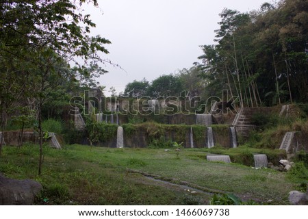 small waterfall between rice field irrigation
