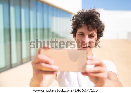 Content woman using smartphone outdoor. Happy middle aged businesswoman taking selfie with smartphone outdoor. Technology concept