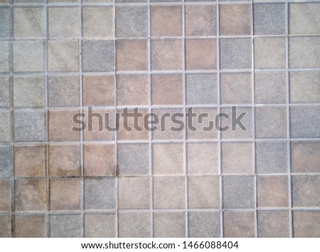 rough gray paving pattern for background. textured tiles. square pattern tiles.