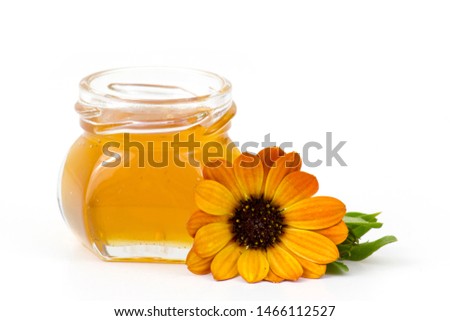 honey and flower on white background