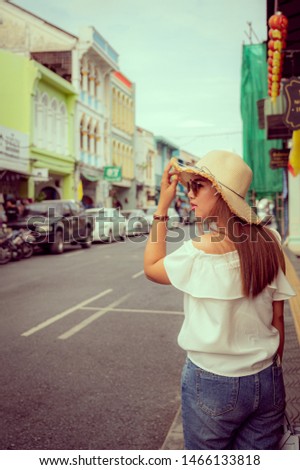 young woman travel in the city at Thailand.vintage tone.