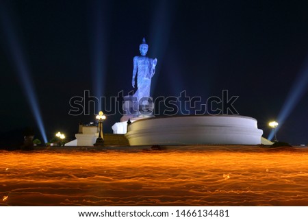 Candle light with religion statue