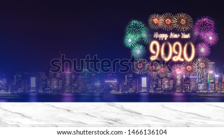 Happy new year 2020 fireworks over cityscape at night with empty marble table top,Panoramic banner mock up template for display or montage of product for holiday promotion advertising