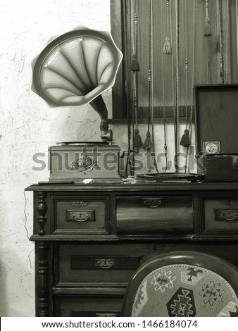 Black and white photo. Old gramophone. Retro music, songs and records...