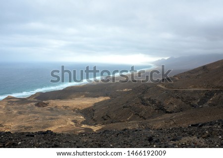 Long Sand Beach of El Cofete From the Mountains on a Cloudy Day