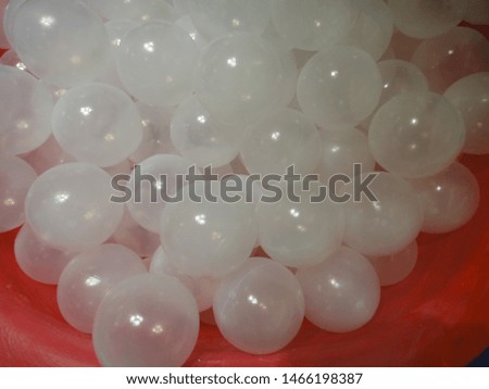 artificial white bubble on red fabric
