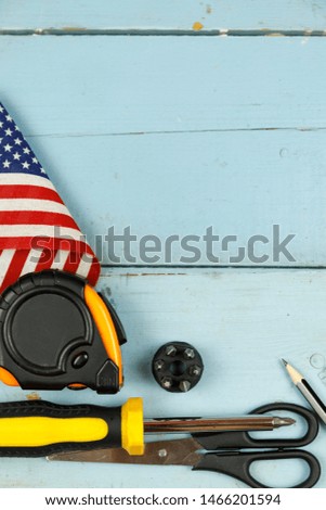 Happy Labor day. Construction tools. Copy space for text on wood background.