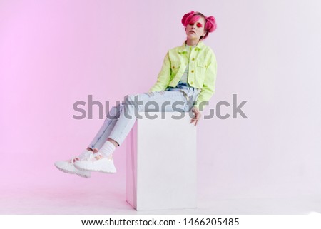 woman beautiful style fashion studio sitting on a cube