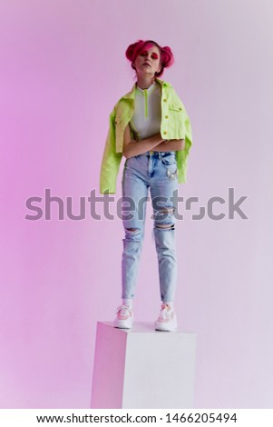 woman standing in a cube fashion style