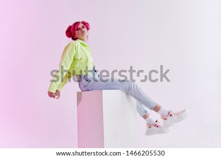 woman beautiful style fashion studio sitting on a cube