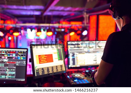 DJ work at a nightclub, Music club party, Concert equipment, a mixer and DJ console. The concept of disco, entertainment, holiday. Soft focus picture