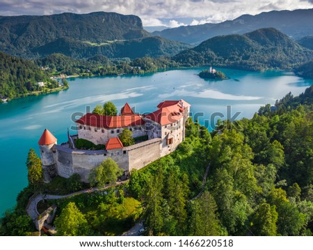 Bled, Slovenia - Aerial view of beautiful Bled Castle (Blejski Grad) with Lake Bled (Blejsko Jezero), the Church of the Assumption of Maria and Julian Alps at background on a summer day Royalty-Free Stock Photo #1466220518