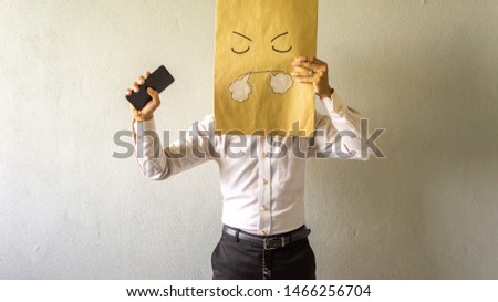 Angry businessman with smartphone in his hand. Business communication problem concept.