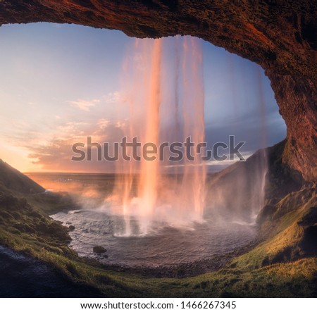 Seljalandsfoss waterfall during the sunset, is located in the South Region in Iceland right by Route 1. 

