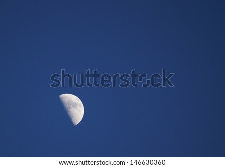 Half moon on blue sky