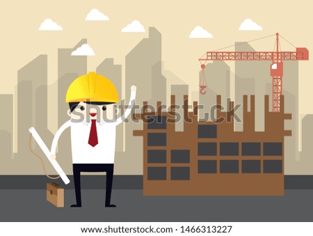 engineer stand with yellow helmet with construction site on background