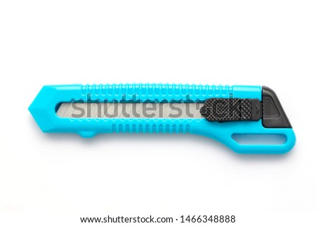 Blue cutter knife isolated on white background. Royalty-Free Stock Photo #1466348888