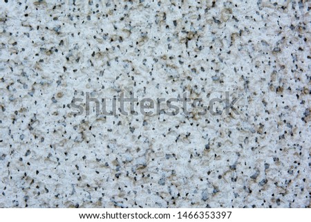 Background of small white and black rocks. Background and texture of small white and black rocks