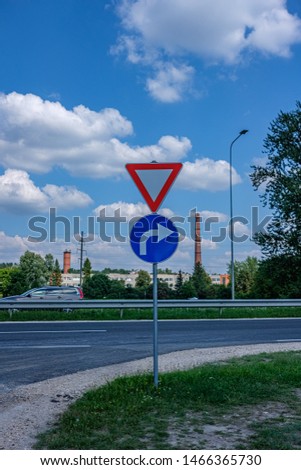 road signs showing directions on the street