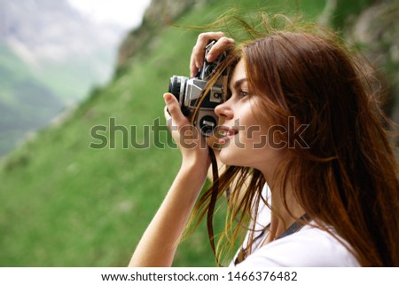 woman takes pictures of nature