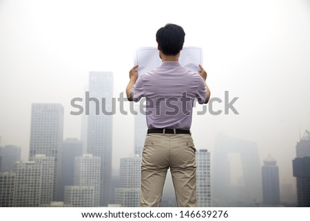 Mid Adult Man In Front Of Cityscape