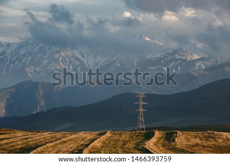Beautiful View of High Voltage Pole on the High Mountain under the Blue Sky.
