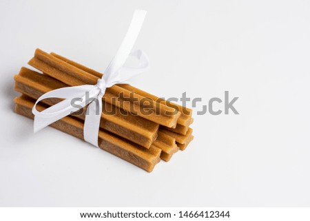 Dog food sticks on a white background