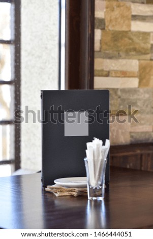 Mock up Menu frame on Table in Bar restaurant cafe. Catalogue. 