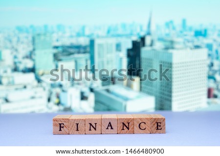 Business, economics and investment concept. Finance character against a background of skyscrapers.