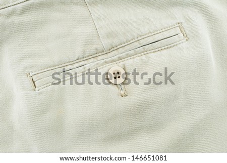 Close up of trousers - Pocket on pants with botton, detail