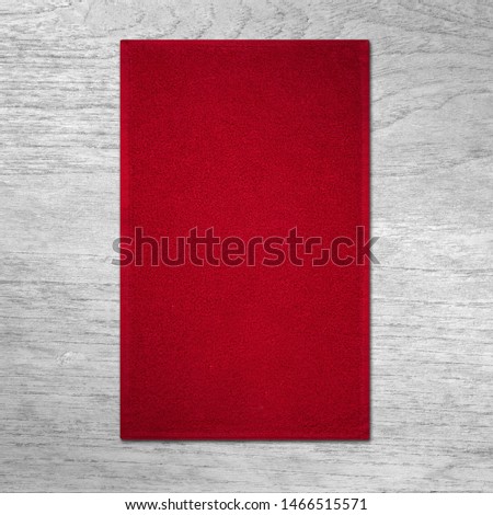 red towel on wooden background