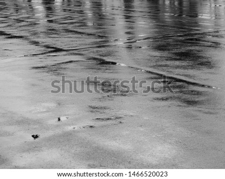 texture of wet asphalt road after rain Royalty-Free Stock Photo #1466520023