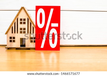 House symbol on a white wooden background 