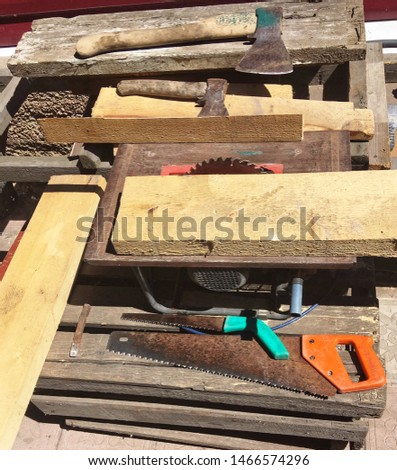 Instruments for building. Saw hammer nail catcher self-tapping trowel spade shovel pasatizhi pliers. Royalty-Free Stock Photo #1466574296