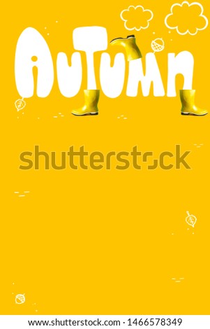 The inscription autumn in large letters on a colored background. As well as yellow rubber boots and tree leaves