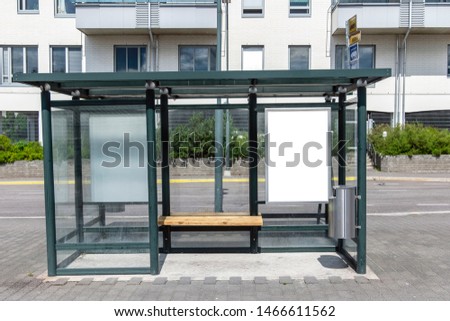 two Vertical blank white billboard at bus stop on city street. In the background buildings and road. Mock up. Poster in Sunny summer day. Royalty-Free Stock Photo #1466611562