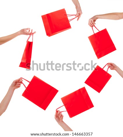 Concept of shopping sale with red bags isolated on white background