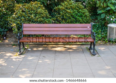 Bench in outdoor park resting and enjoying the summer. banks around the world (europe)