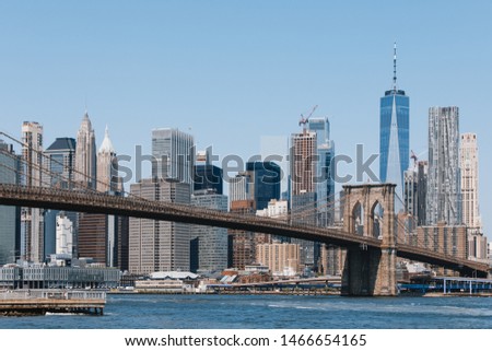 Manhattan skyline with the Brooklyn Bridge in the foreground and The Freedom Tower in the background.