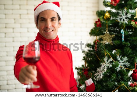 Couples in the living room Give Christmas gifts to each other and drink to celebrate happily during Merry Christmas and Happy New Year