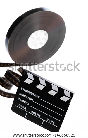 A black film case reel and a cinema clap isolated on white