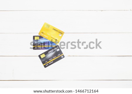 Top view of business blue credit card mockup with rounded corners on white wood background. Copy space