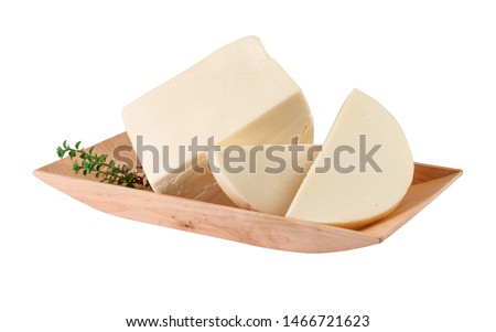 Provolone cheese into a wooden tray with fresh oregano.Clipping path. Royalty-Free Stock Photo #1466721623