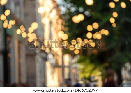 Abstract Blurred image of Night Festival on street with light bokeh for background usage. (vintage tone)
