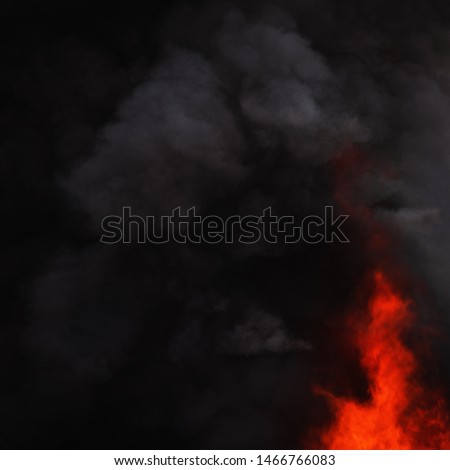 Black motion clouds of strong red fire smoke covered sky. Motion blur and defocus from natural fire and high temperature from flames. Atmospheric and smoke dispersion.