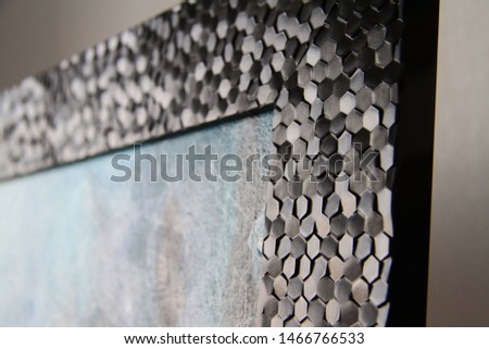 Black honeycomb picture frame closeup