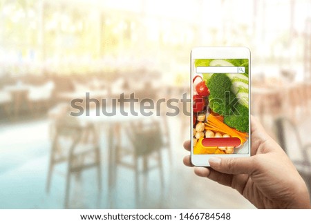 Online order Food shopping concept on touch screen on woman hand. Food delivery service express that is cooked by restaurant for takeout and icon symbol media. Business and technology concept.
