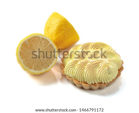 Tartlet with lemon cream isolated on a white background.