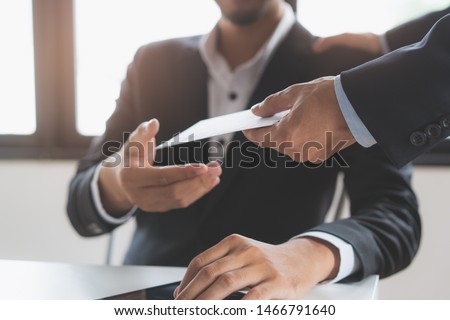 Close up view of  office worker receiving salary from boss. Royalty-Free Stock Photo #1466791640
